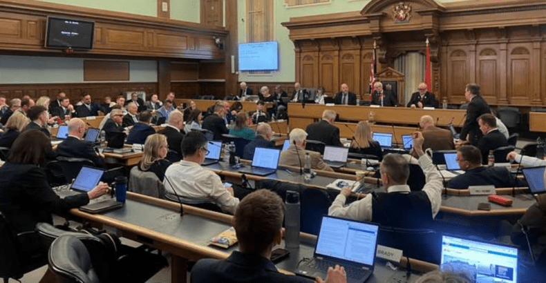 Kent council meeting debating migrant emergency motion