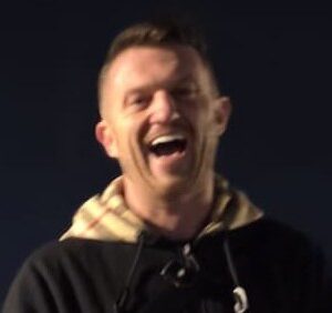 Tommy Robinson laughs